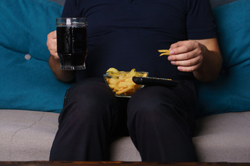 overeating, sedentary lifestyle, bad habits, food addiction, eating disorders. fat overweight man...