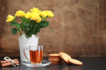 A cup with tea on the table