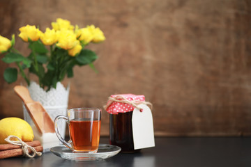 A cup with tea on the table
