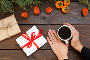 a cup of tea in hand Christmas background Christmas tree new year gifts