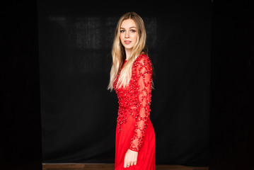 Fototapeta premium beautiful young girl in red dress