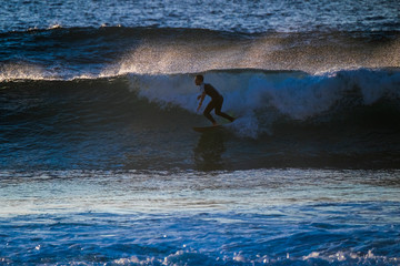 Surf boy athlete train and enjoy the power of the nature on the ocean waves do tricks. Youthful and happiness for alternative sport and lifestyle concept. Milennial people have fun