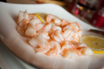 Shrimps with lemon in chinese restaurant.