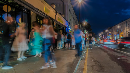 people have fun on the city streets on a summer evening on Saturday