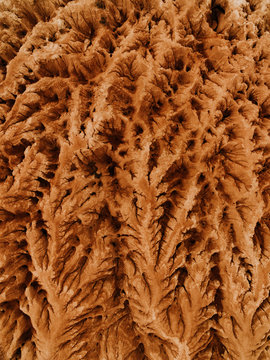 Aerial picture of a desert with eroded mountains