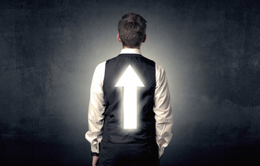 Young businessman standing and thinking about which direction to choose