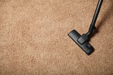 Vacuum cleaner on carpet. Dust and allergy. Copy space for text.