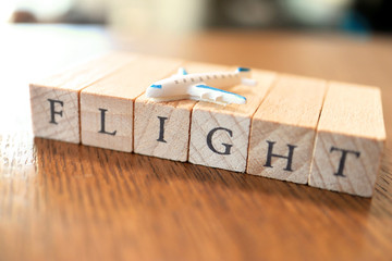 Wooden Text Block of Flight with Small Airplane