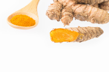 Turmeric powder and fresh turmeric - Curcuma longa.