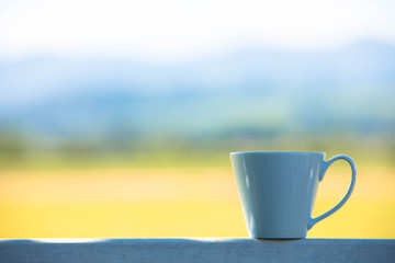 Coffee Cup on Wood, Rice Field Background