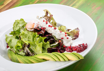 Salad with kino, avocado and poached egg