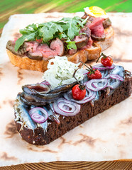 Bruschetta with roast beef and sprat
