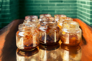 variety of opened glass jars with jam