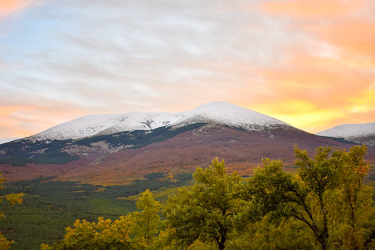 VIEW OF A CLOLORFUL SUNSET IN THE SNOWY MOUNT OF MONCAYO IN ARAGON SPAIN IN A DAY OF AUTUMN