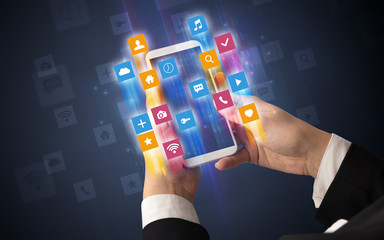Female hand using smartphone with colorful angular fast switching application icons around