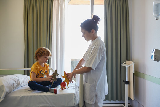 Child patient and doctor in a relax moment in the hospital room