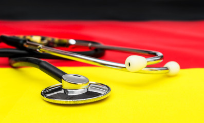 Stethoscope on German flag. Medical concept. Close up.
