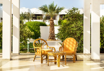 Table and chairs at patio of hotel outdoors.