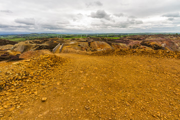 Parys Mountain, unearthly landscape like another planet, with wind turbines.