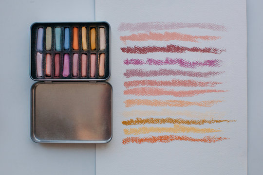 Colorful soft pastel chalks and it's swatches on paper