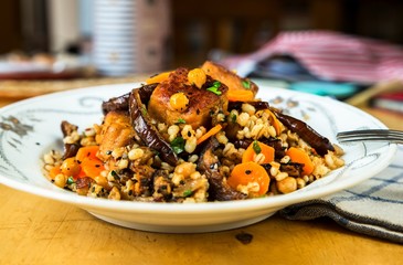 Chickpeas and barley with fried vegetable.