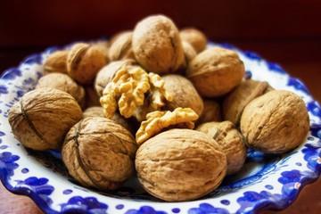Walnuts in blue bowl.