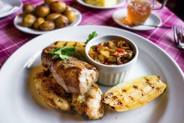 Pork and chicken meat with vegetable, potato.