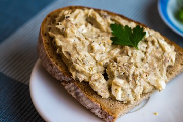 Sliced bread with fish spread,closeup.
