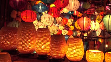CLOSE UP Countless oriental lamps are lit up on a festive night in Vietnam. Beautiful shot of colorful lanterns during the full moon celebration in Hoi An. Idyllic shot of numerous traditional lights