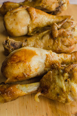 fried chicken in soya sauce on a wooden board