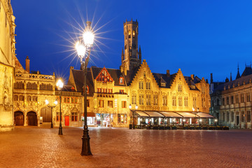 Fototapeta na wymiar Scenic night cityscape with a medieval tower Belfort and Burg Square in Old Town of Bruges, Belgium