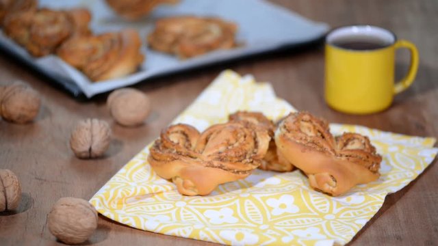 Yeast sweet buns in the shape of a heart on the table.
