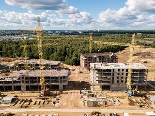 Obraz premium Construction site with crane and building. Aerial drone view