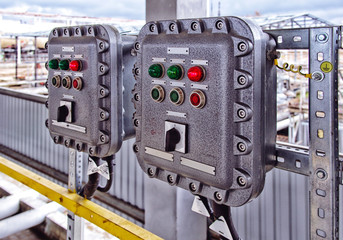 Part of power plant control panel with switches and lamps