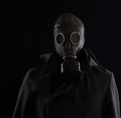 portrait of a man in gas mask.Environmental disaster. Post apocalyptic survivor