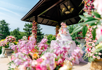 Desserts and flowers in an outdoor wedding