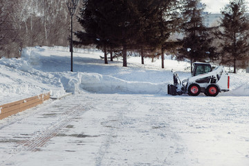 Winter park and snow machine.