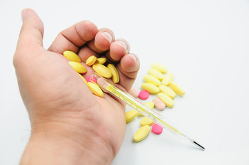 Colorful pills and medicines in the hand