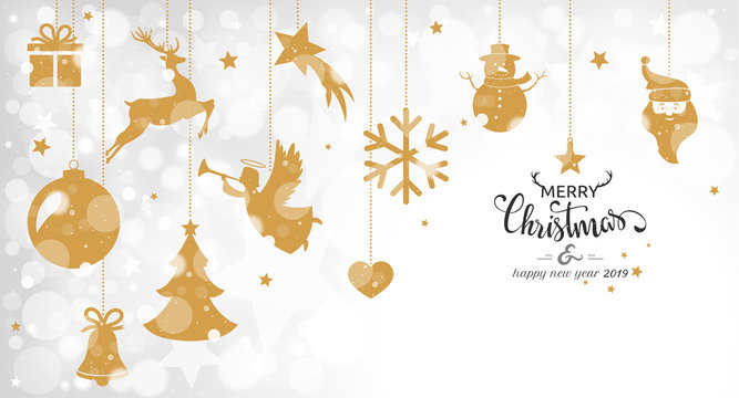 Christmas card with hanging golden decorations on bokeh