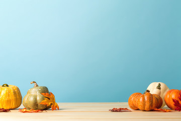 Collection of autumn pumpkins on a blue background