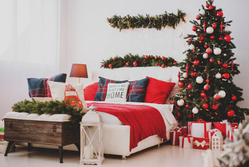 Christmas decorations in the bedroom or studio with bed and pillows