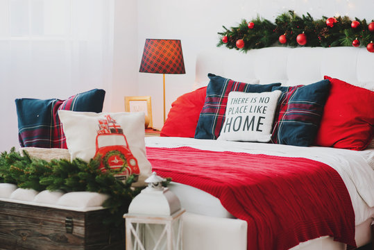 Christmas decorations in the bedroom or studio with bed and pillows