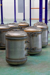 Stainless steel pressure tanks in a production workshop