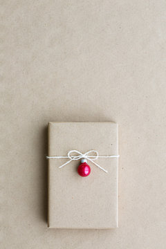 Christmas gift decorated with red Christmas ornament