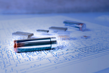 The electric battery is on the electronic circuit with microcircuits.