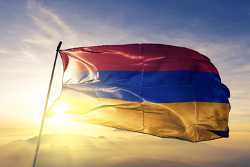 Armenia Armenian flag textile cloth fabric waving on the top sunrise mist fog