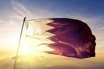 Bahrain Bahraini flag textile cloth fabric waving on the top sunrise mist fog