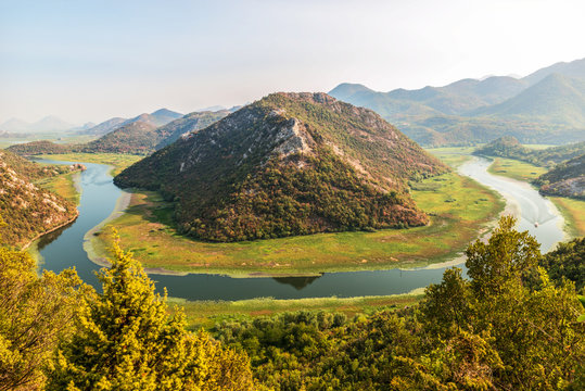 View of the western tip of Lake Skadar, Montenegro. Crnojevic river bend around green mountain peaks. Great great view of the river.