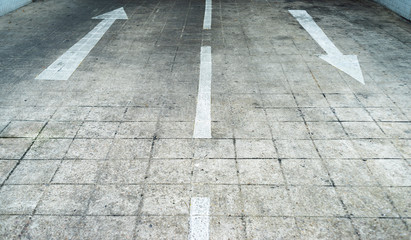 Arrow on the road and white color