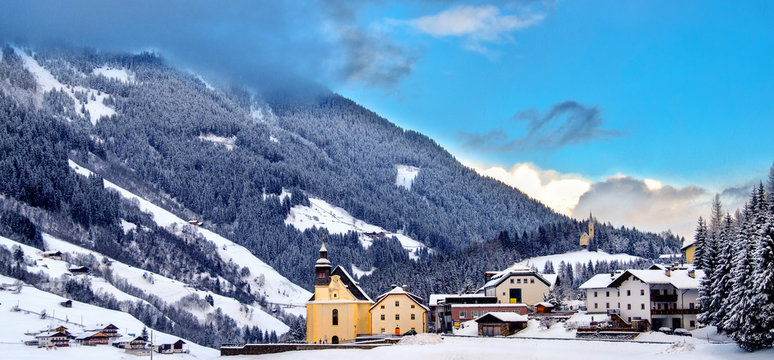 panoramic overview church snowy valley beautiful winter sunny day Trentino Alto Adige Italy